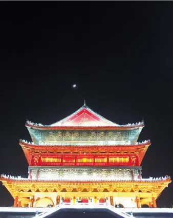  ??  ?? The Drum Tower, one of Xi’an’s most popular tourist attraction­s, is a blaze of light at night. — Wing Tan
