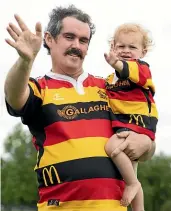  ?? CHRISTEL YARDLEY/STUFF ?? Hamilton’s Mooloo parade made its return on Saturday. Waikato rugby union fan, Ryan Wild, pictured above with son Quinn, remembers attending the parade as a child and was now bringing his own kin along too.