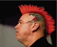  ??  ?? Struggling Peter Wright went out in the last eight