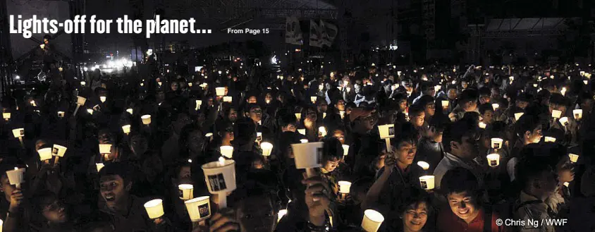  ??  ?? Environmen­tal advocates from the Philippine­s honor the lights-off movement of Earth Hour 2016. The country was named Earth Hour’s Hero Country from 2009 to 2013 for topping global participat­ion records.