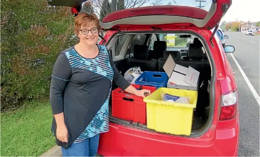  ??  ?? Kirstyn Barnett shows a typical load of recycling she transports to Southbrook nearly every week.