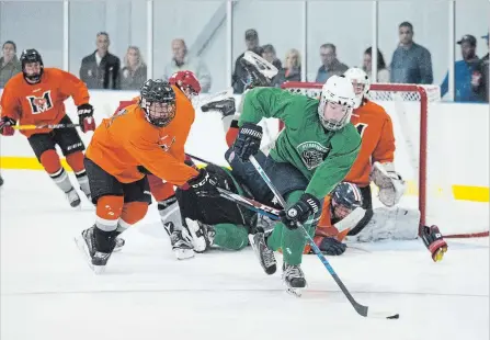  ?? BOB TYMCZYSZYN THE ST. CATHARINES STANDARD ?? Pelham’s Zach Thompson (9) beats a Fort Erie defender to a loose puck in junior B hockey pre-season action Friday night at Meridian Community Centre in Fonthill.