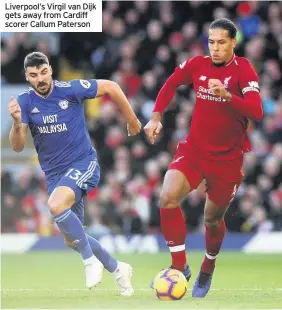  ??  ?? Liverpool’s Virgil van Dijk gets away from Cardiff scorer Callum Paterson