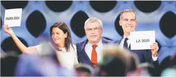  ??  ?? Internatio­nal Olympic Committee (IOC) president Thomas Bach (centre) next to Mayor of Paris Anne Hidalgo and Mayor of Los Angeles Eric Garcetti ratifies Paris 2024 and Los Angeles 2028 host cities for Olympics games during the 131st IOC session in...