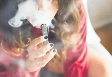  ?? Photo / Bloomberg ?? In the US, ‘Juuling’ has become synonymous with e-cigarette smoking.