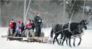  ?? J O H N MA H O N E Y, MO N T R E A L G A Z E T T E F I L E S ?? Winter activities in Hudson have included rides on a horse- drawn sleigh across the ice at the Shiver and Shake party on Pine Lake.