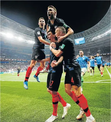  ?? Picture: CARL RECINE/REUTERS ?? MAGIC MOMENT: Croatia’s Mario Mandzukic celebrates scoring their second goal with teammates