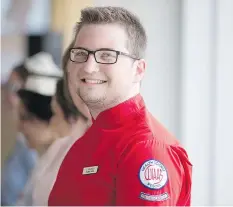  ??  ?? Fred Entz shows off a red nursing uniform at the anniversar­y celebratio­n on Saturday.