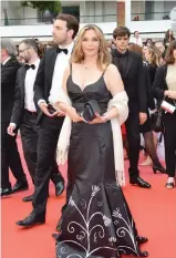  ??  ?? Roya Ghaznavi walks the red carpet at the Cannes Film Festival in Helen Gerro’s hand-painted gown.