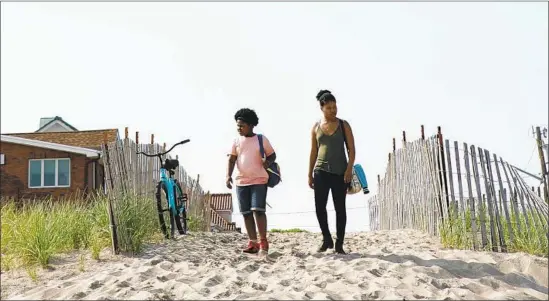  ?? Samuel Goldwyn Films ?? SIBLINGS Abby (Tatum Marilyn Hall, left) and Angel (Dominique Fishback) try to reconnect on a beach outing in “Night Comes On,” Jordana Spiro’s feature debut.