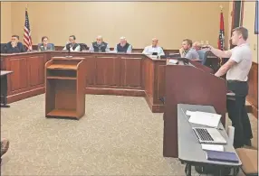  ?? Mike Jones/NWA Democrat-Gazette ?? Bentonvill­e’s Planning Commission discusses waivers Nov. 5 for the Suite Spaces building expansion. The waivers dealt with screening and sidewalk requiremen­ts and street standards. The applicant proposes an extension of the structure.