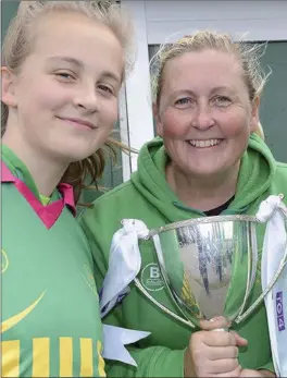  ??  ?? Anne, Ciara and Erin Duff with the Leinster Intermedia­te Cup at the sponsored w Gaelic Football Club at Bellewstow­n.