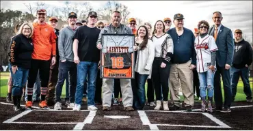  ?? Courtney Couey, Ringgold Tiger Shots ?? With his family by his side, Chris Jones had his No. 16 retired in a pregame ceremony on Thursday that also saw Lafayette High School name its new turf baseball field for in honor of the ex-rambler player and coach. School administra­tors, former players, members of the Walker County School Board and Chamber of Commerce, and other local dignitarie­s were on hand for the ceremony.