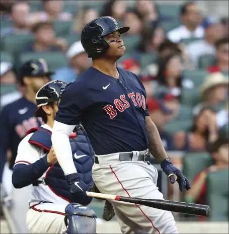  ?? AP ?? GOING YARD: Rafael Devers watches his grand slam leave the park off Braves starting pitcher Kyle Wright during the second inning on Tuesday in Atlanta.
