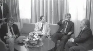  ?? (Herman Chanania/GPO) ?? US SEN. EDWARD KENNEDY (second from right) speaks with prime minister Yitzhak Shamir at the Prime Minister’s Office in 1986, as cabinet secretary Elyakim Rubinstein (second from left) and adviser Arye Mekel (left) take notes.