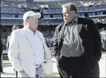  ?? Marcio Jose Sanchez The Associated Press ?? Raiders owner Mark Davis, left, and GM Reggie McKenzie. Most experts expect the Raiders to try to bolster their defense when it comes time for picking in the NFL draft.