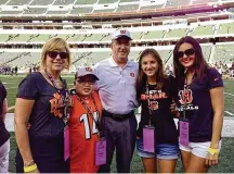  ?? CONTRIBUTE­D ?? Paul Sparling and his family on the sidelines of a Bengals’ game several years ago: (left to right), wife Karen, son Kenneth, Paul and daughters Natalie and Ashley.