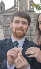  ??  ?? Crìsdean MacCoinnic­h, of Glasgow, and Isabelle Bain, from Am Bac, after respective­ly winning the Traditiona­l Gold Medal final competitio­ns for men and women.