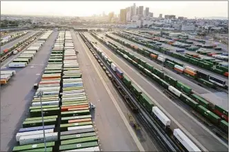  ?? Getty Images ?? Shipping containers and rail cars sit in a Union Pacific Intermodal Terminal rail yard on Nov. 21 in Los Angeles.