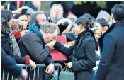  ??  ?? The Prince and Ms Markle watch a dance at Star Hub after greeting the crowds, left. Below, Harry Smith and Megan Taylor