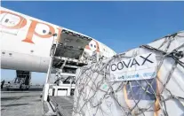  ?? REUTERS ?? Ethiopian Airlines staff unload Astrazenec­a/oxford vaccines under the COVAX scheme against the coronaviru­s disease from a cargo plane at Bole Internatio­nal Airport in Addis Ababa, Ethiopia.