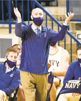  ?? PAULW. GILLESPIE/CAPITAL GAZETTE ?? Navy coach Ed DeChellis, who is 62, has survived a stroke and is diabetic, says the coronaviru­s worries him as his team begins its season.