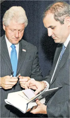  ??  ?? ‘SURROGATE SON’ BURN: Doug Band (right, with Bill Clinton in 2007), tells Vanity Fair that Bill (despite his denials) DID visit Jeffrey Epstein’s “Pedophile Island” and other secrets.