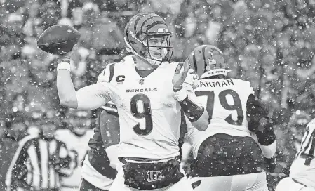  ?? GREGORY FISHER/ USA TODAY SPORTS ?? Bengals quarterbac­k Joe Burrow had two touchdown passes against the Bills on Sunday at snowy Highmark Stadium.