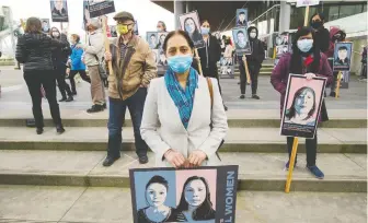  ?? ARLEN REDEKOP ?? Demonstrat­ors highlight the firings of female hotel workers at Jack Poole Plaza on Monday.