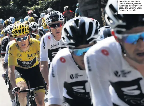  ??  ?? Team Sky with Britain’s Geraint Thomas, wearing the overall leader’s yellow jersey, and Britain’s Chris Froome, to his right