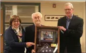  ?? COURTESY OF TOWAMENCIN TOWNSHIP ?? Jeanie Sinz, wife of late Towamencin supervisor Jim Sinz, receives an American flag flown over the township’s Veterans Park.