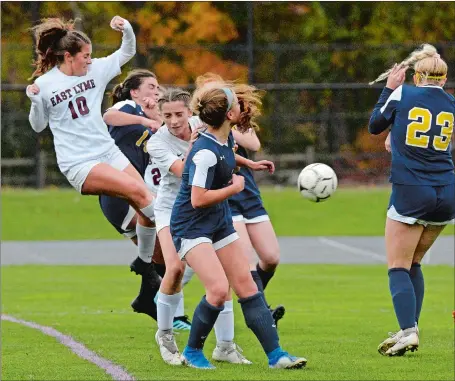 ?? DANA JENSEN/THE DAY ?? East Lyme’s Alivia Catanzaro (10) rises above a crowd to score a goal during the Vikings’ 2-0 road victory over Woodstock Academy on Wednesday. East Lyme dethroned the Centaurs as Eastern Connecticu­t Conference Division I champion.