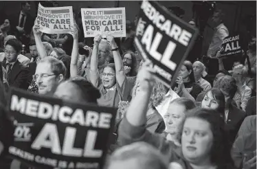  ?? New York Times file photo ?? Nurses rally on Capitol Hill in support of Medicare for all in 2017. The question of whether to support a single-payer health care model has been a thorny dilemma for several Democratic presidenti­al candidates.