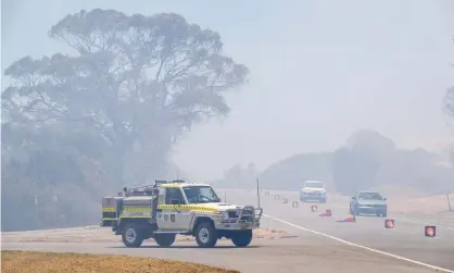  ?? Photograph: Richard Wainwright/EPA ?? A bushfire threatenin­g lives and homes in Perth’s southern suburbs remains unpredicta­ble.