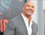  ?? KEVIN WINTER/GETTY IMAGES/AFP ?? Dwayne Johnson used his bond with his dog, Hobbs, to prepare for his upcoming adventure film, Rampage