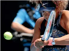  ?? AP ?? Naomi Osaka hits a backhand en route to a straight sets win over Hsieh Su-wei.