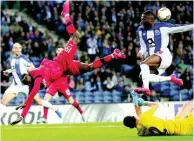  ?? AP ?? Porto’s Chancel Mbemba (upper right) and Porto’s goalkeeper Agustin Marchesin (lower right) defend against Leverkusen’s Moussa Diaby during the Europa League round of 32 second-leg soccer match between FC Porto and Bayer Leverkusen at the Dragao stadium in Porto, Portugal, Thursday, February 27, 2020.