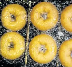  ?? HANDOUT ?? Donuts destined for a Phish concert are fried, at Federal Donuts in Philadelph­ia. Doughnuts are everywhere in Phish’s Baker’s Dozen 13-show residency at Madison Square Garden, which kicked off last week and lasts until Aug. 6.