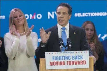  ?? AP PHOTO/ MARY ALTAFFER ?? New York Gov. Andrew Cuomo is joined by his girlfriend Sandra Lee, left, as he speaks to supporters during an election night watch party hosted by the New York State Democratic Committee, Tuesday, Nov. 6, 2018, in New York.