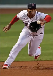  ?? STuArT CAhill / hErAld sTAFF FilE ?? GLOVE WORK: Rafael Devers has led all third basemen in errors in three consecutiv­e seasons.