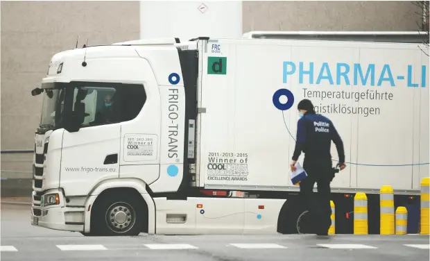  ?? FRANCISCO SECO / THE ASSOCIATED PRESS ?? A refrigerat­or truck leaves the loading bay at the Pfizer plant in Puurs, Belgium. The European Union may ban exports of the COVID-19 vaccine, which could leave Canada short. Trade Minister Mary Ng is confident Canada will not be left in the lurch, but the EU has provided no guarantee.
