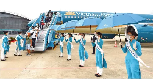  ?? ?? Vietnam Airlines thực hiện nhiều chuyến bay thí điểm đón khách du lịch quốc tế đến Việt Nam.
Ảnh | VNA