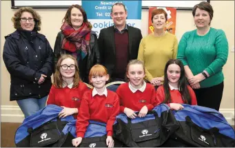  ??  ?? Newmarket Girls School pupils Tara O’Connor, Marie O’Connor, Katie Lane and Ellen O’Connor were first in the U-11 category at the Newmarket Credit Union Schools Quiz. Also included are teachers Sheila Daly and Siobhan Collins; Quizmaster Jerry Fitzgerald; and Kay McAuliffe and Dorothy Barrett.