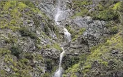  ?? Raul Roa Los Angeles Times ?? A TEMPORARY waterfall flows Wednesday along Highway 39 after recent heavy rains in the Angeles National Forest. The road has since been closed.