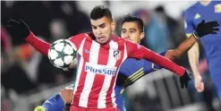  ??  ?? ROSTOV-ON-DON: Atletico Madrid’s Argentinia­n midfielder Angel Correa (L) and Rostov’s Ecuadorian midfielder Christian Noboa vie for the ball during the UEFA Champions League football match between FC Rostov and Club Atletico de Madrid in Rostov-on-Don...