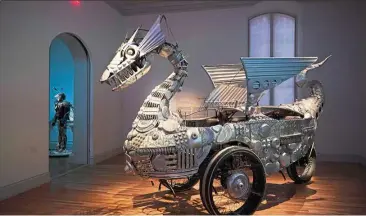  ??  ?? Duane Flatmo’s work Tin Pan Dragon, an animated sculpture built of steel tubing and recycled aluminum.
