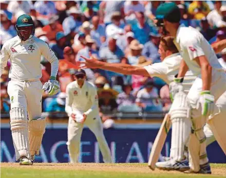  ?? REUTERS PIC ?? England’s Craig Overton dives but fails to take a catch to dismiss Australia’s Usman Khawaja yesterday in the Third Ashes Test in Perth.