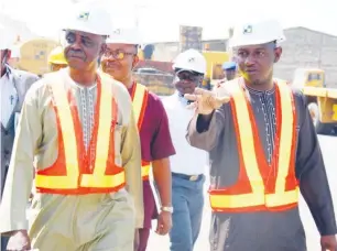  ??  ?? Minister of State Labour and Employment, Prof. Stephen Ocheni and the Executive Director, Dantata and Sawoe during the Integrated Labour Inspection and Enforcemen­t Services to the Abuja office of the company.