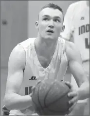  ?? Special to the NWA Democrat-Gazette/CELIA LOONEY ?? The Indians’ Pacyn Reames focuses on the rim as he prepares to shoot a free throw for County Line.