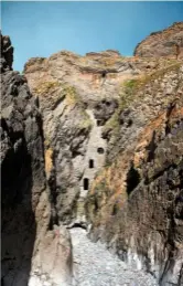  ??  ?? Stone stairways behind the wall blocking Culver Hole in the cliff face connect the three openings. Stories claim it was an old smugglers’ hideout.